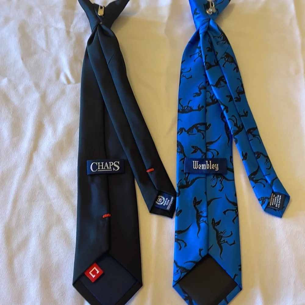 2 clip on ties. One black, one blue with dinosaurs. Very cute. Boys size 6-8